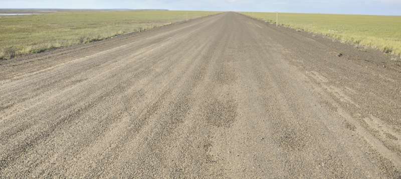 Disintegrating pavement, about 15 miles south of Deadhorse