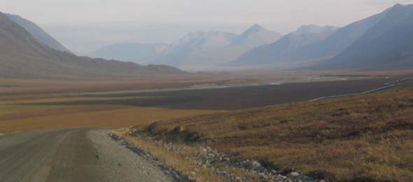 Northbound highway descending toward Atigun River