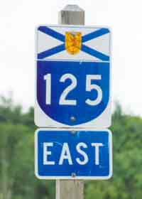 Nova Scotia arterial route 125 marker, blue U-shaped shield topped with provincial flag, all on white background