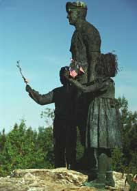 Silent Witness statue, with boy and girl flanking soldier